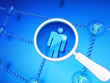 TruthFinder, Instant Checkmate confirm data breach affecting 20M customers Magnifying glass hovering over a person