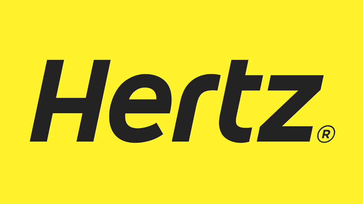 The brand name "Hertz" written in black, italicized, against a yellow backdrop