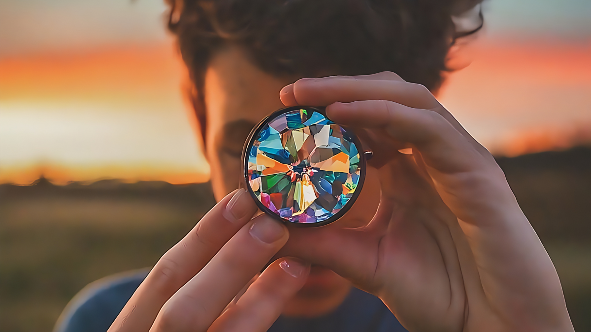 Person looking through a kaleidoscope