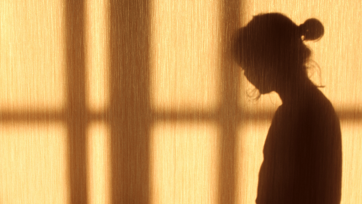 Shadow of woman looking side on