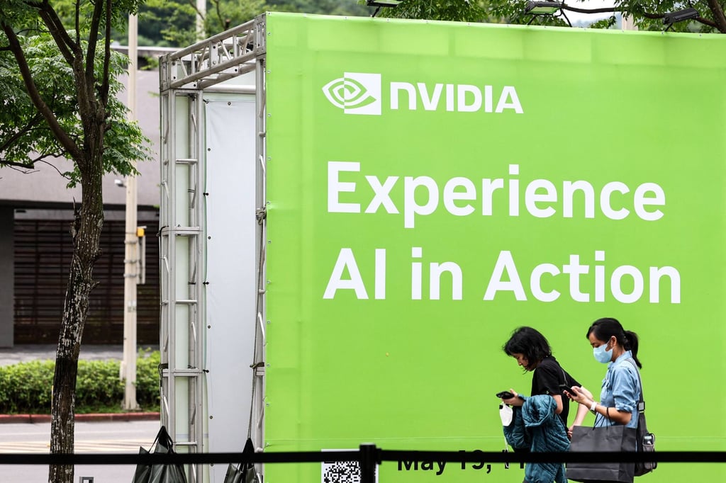 People walk past an Nvidia display advertisement in Taipei during the Computex 2025 trade show on May 19, 2025. Photo: AFP