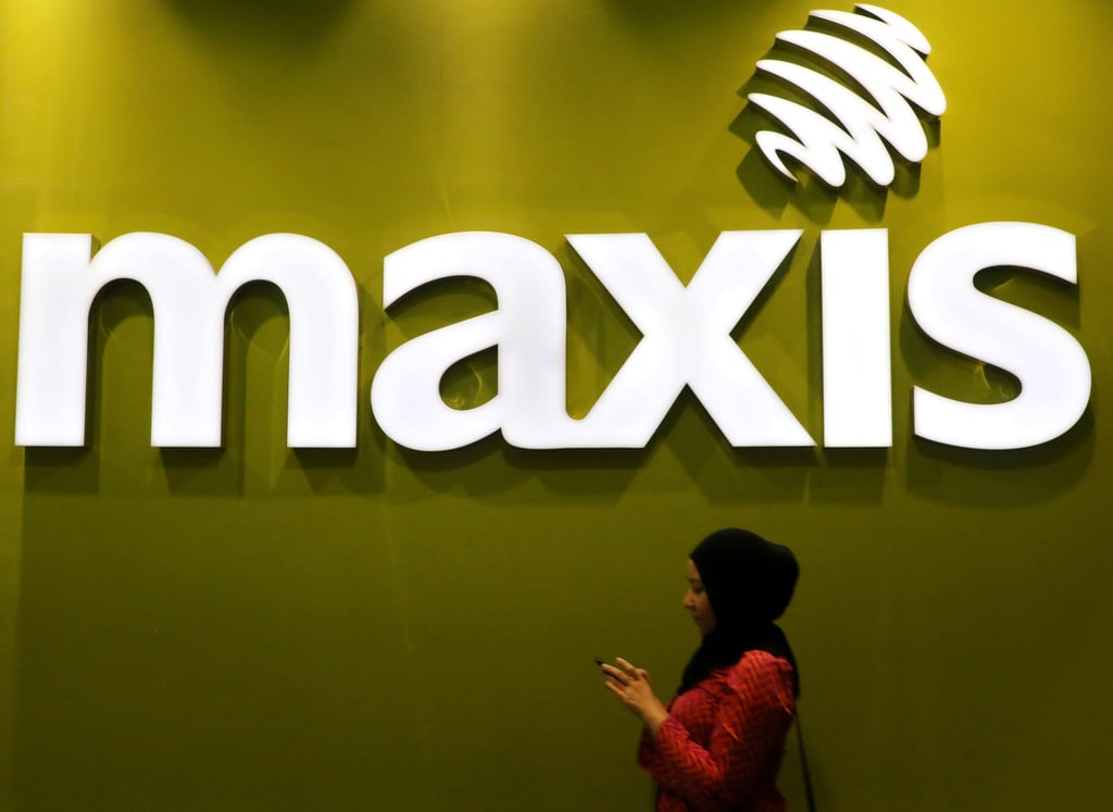 Malaysia assures users their privacy is protected in mobile data grab: ‘truly anonymous’ A woman walks past a logo of Maxis at its headquarters in Kuala Lumpur. The mobile network operator has already submitted a full report with anonymous data. Photo: Reuters