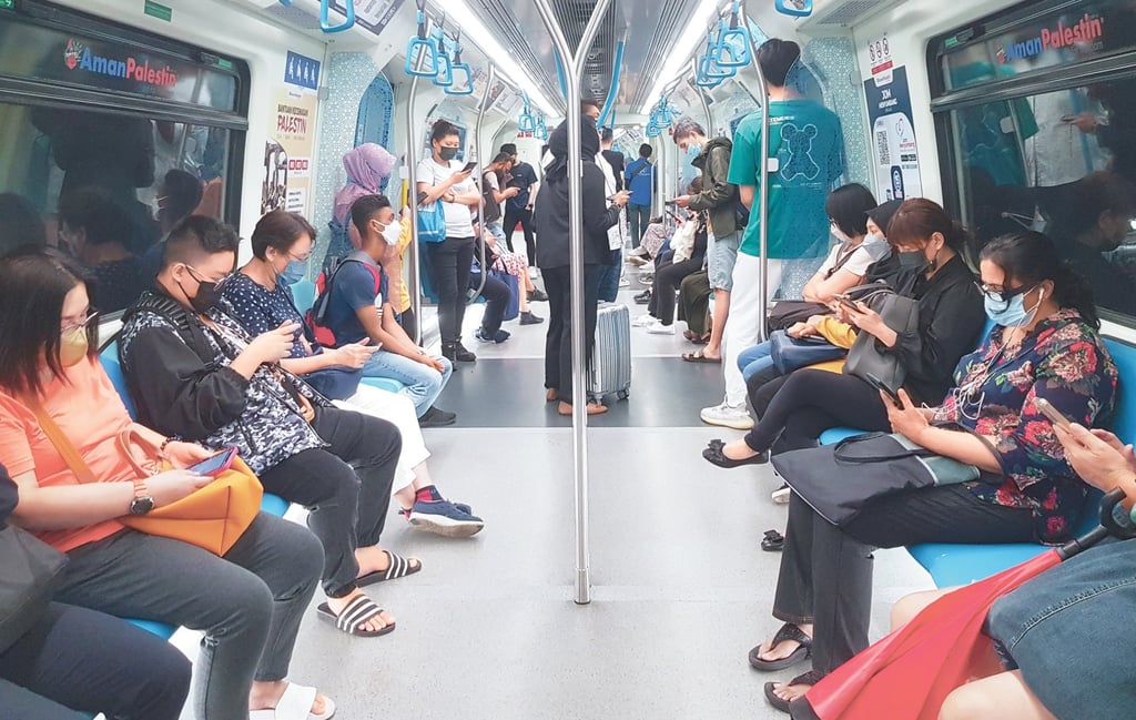 Malaysia mulls making digital ID mandatory as security fears hinder adoption Commuters on Malaysia’s Rapid KL rail. Malaysians are wary of downloading MyDigital ID because of recent security breaches. Photo: Shutterstock