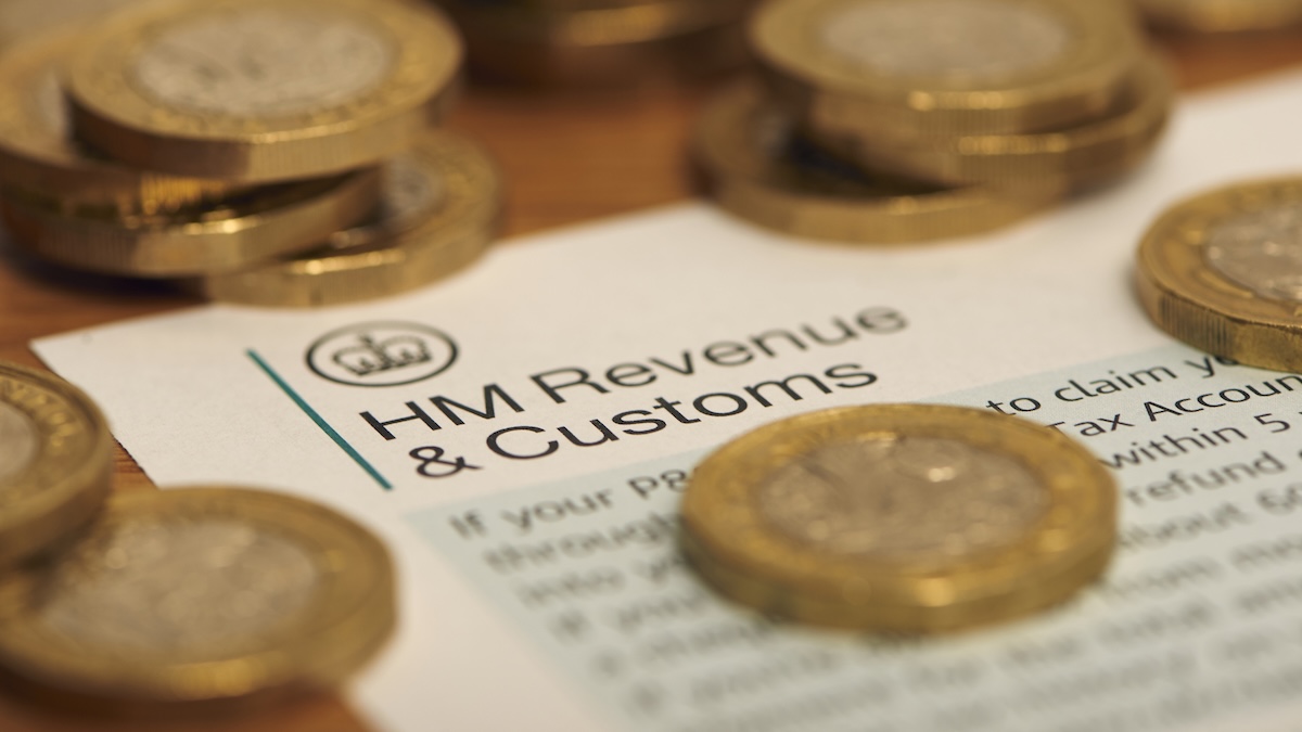 Scam hunter scammed by tax office impersonators A letter from HMRC is laid flat on a table with English pound coins scattered across.