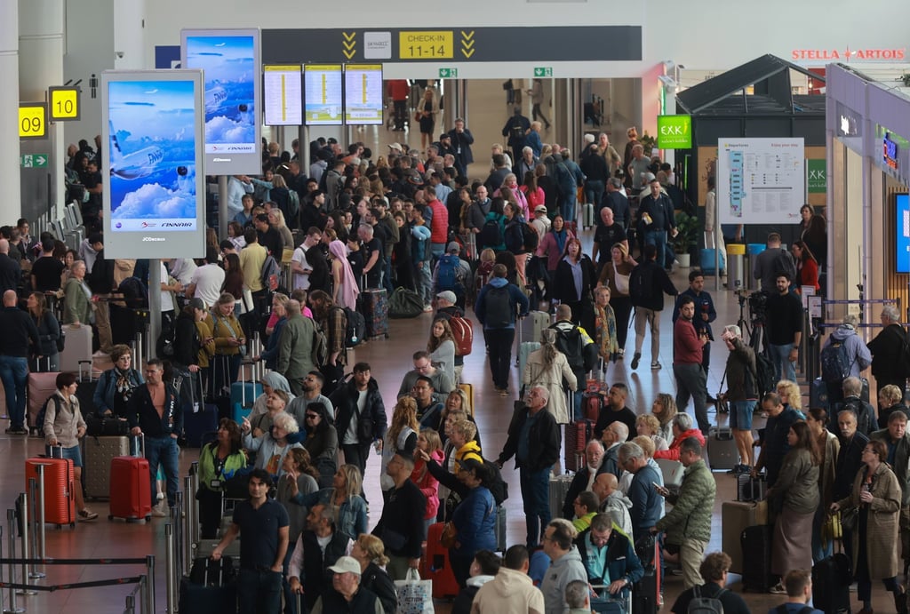 Delays continue at European airports following cyberattack Passengers queue in line at Brussels Airport where dozens of flights were cancelled on Sunday. Photo: EPA