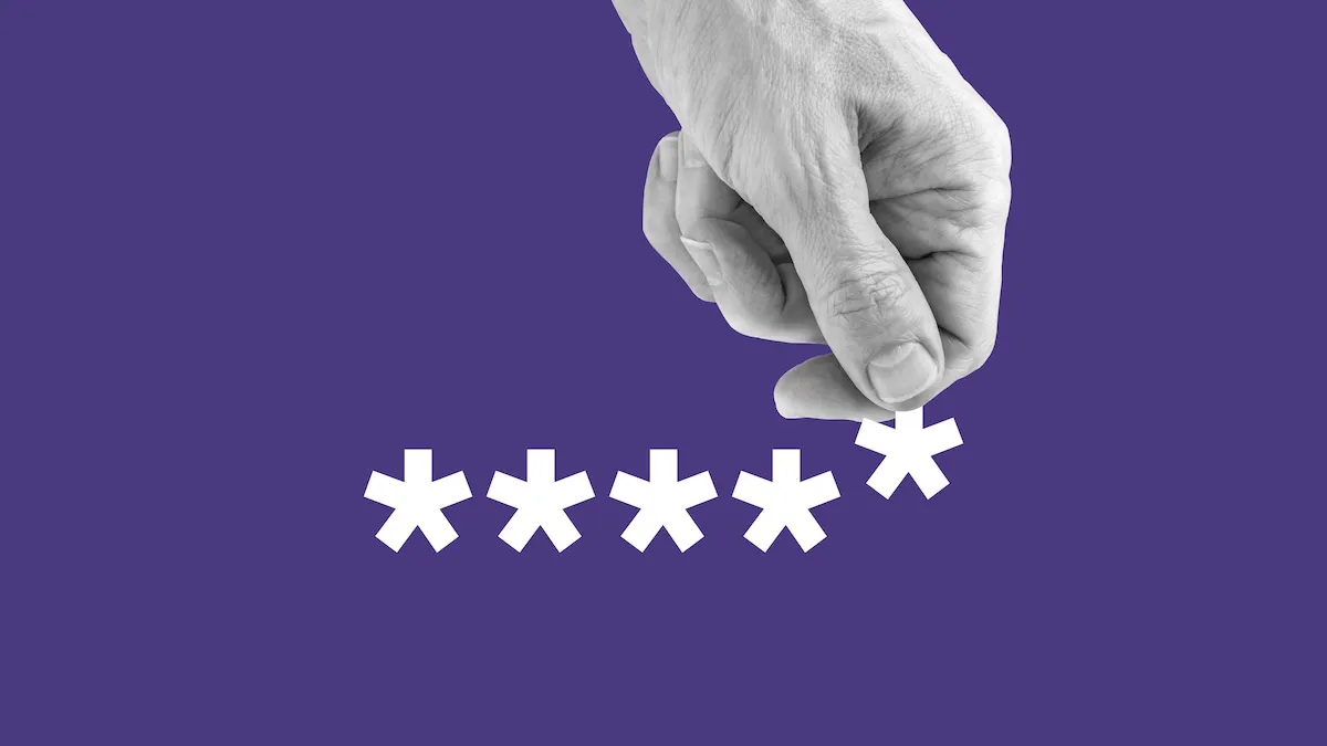 A hand reaches down to grab one asterisk from a written password.