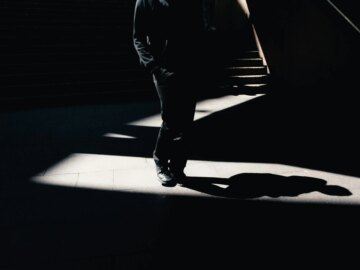 When AI safety constrains defenders more than attackers