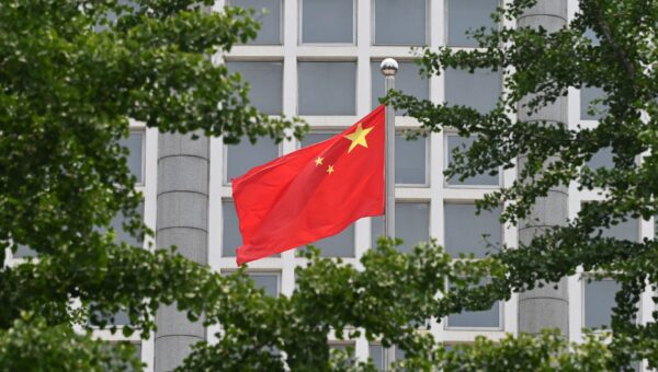 The Chinese national flag flies outside the Ministry of Foreign Affairs in Beijing on July 26, 2023. (Photo by GREG BAKER/AFP via Getty Images)