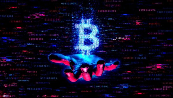 Hand holding bitcoin
